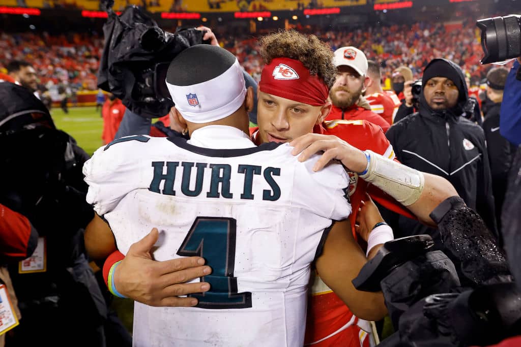 KANSAS CITY, MISSOURI - NOVEMBER 20: Jalen Hurts #1 of the Philadelphia Eagles talks with Patrick Mahomes #15 of the Kansas City Chiefs after their game at GEHA Field at Arrowhead Stadium on November 20, 2023 in Kansas City, Missouri.