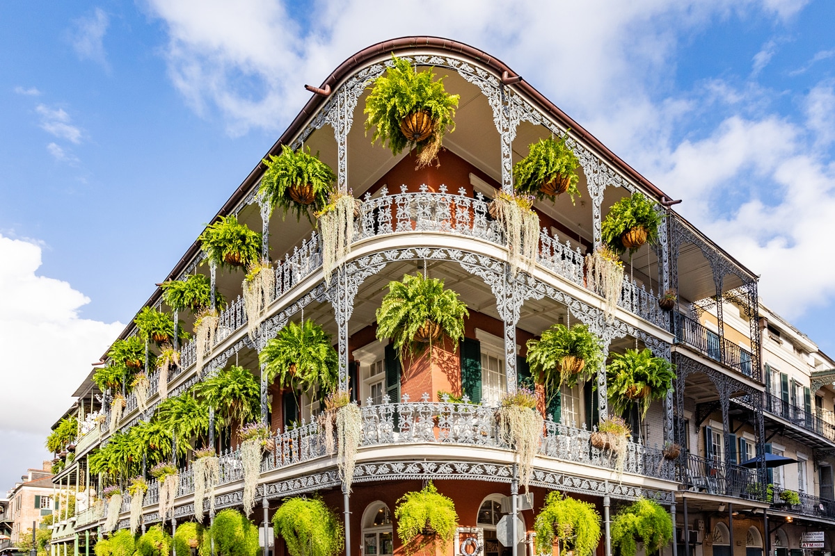 old french building with typical iron balconies in the french quarter in New Orleans, Louisiana, USA