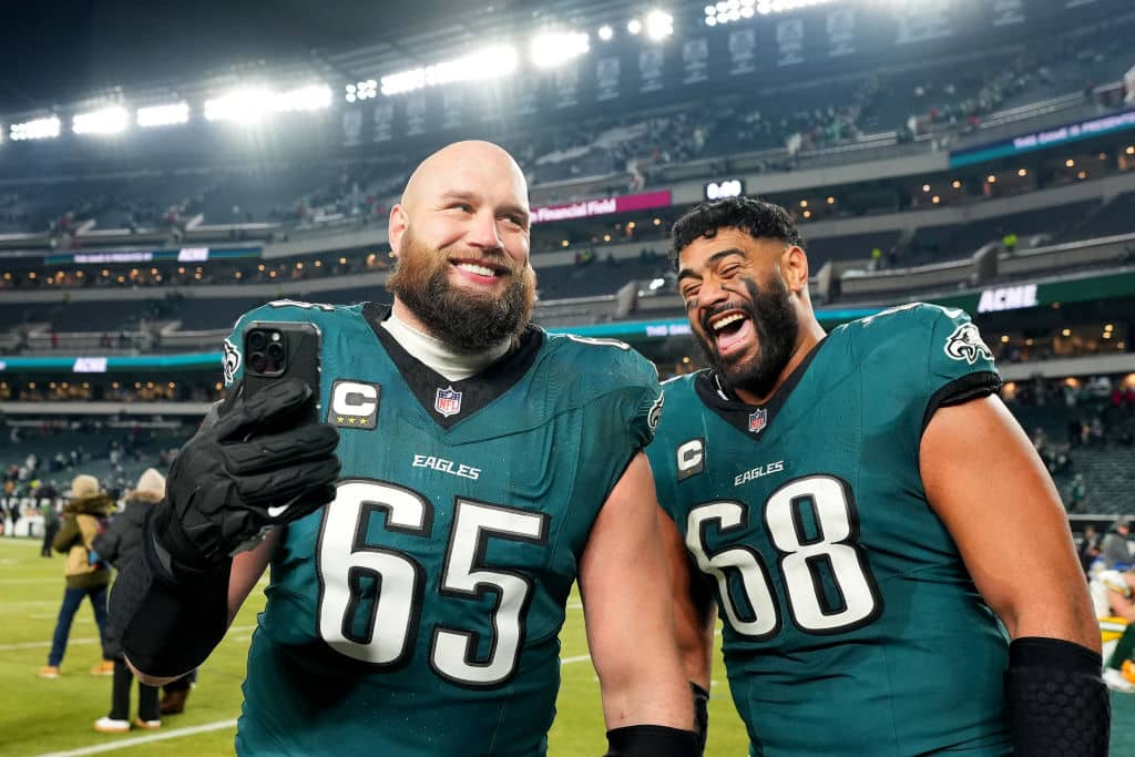 PHILADELPHIA, PENNSYLVANIA - JANUARY 12: Lane Johnson #65 and Jordan Mailata #68 of the Philadelphia Eagles celebrate beating the Green Bay Packers 22-10 during the NFC Wild Card Playoff at Lincoln Financial Field on January 12, 2025 in Philadelphia, Pennsylvania.