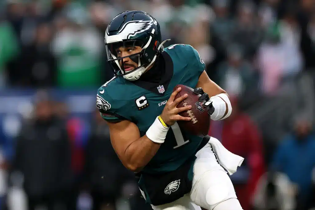 Jalen Hurts #1 of the Philadelphia Eagles looks to pass against the Los Angeles Rams during the first quarter during the NFC Divisional Playoff