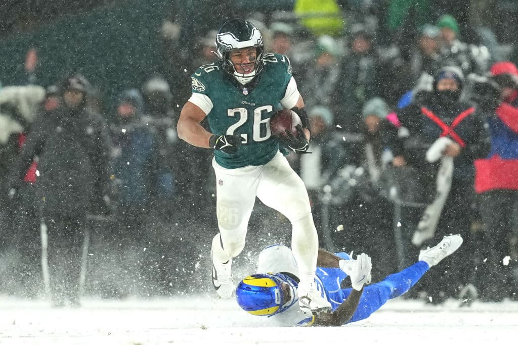 PHILADELPHIA, PENNSYLVANIA - JANUARY 19: Saquon Barkley #26 of the Philadelphia Eagles runs the ball for a 78-yard touchdown against the Los Angeles Rams during the fourth quarter in the NFC Divisional Playoff at Lincoln Financial Field on January 19, 2025 in Philadelphia, Pennsylvania.