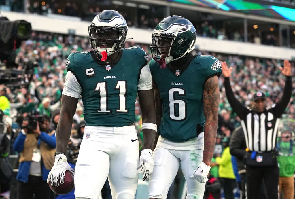 PHILADELPHIA, PENNSYLVANIA - JANUARY 26: A.J. Brown #11 of the Philadelphia Eagles celebrates his touchdown catch with teammate DeVonta Smith #6 while playing against the Washington Commanders during the second quarter in the NFC Championship Game at Lincoln Financial Field on January 26, 2025 in Philadelphia, Pennsylvania.