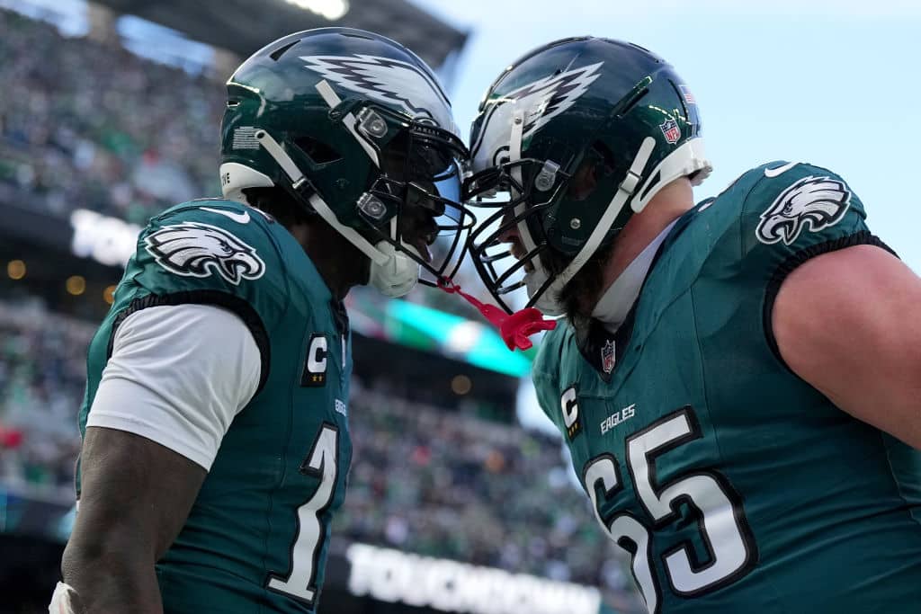 PHILADELPHIA, PENNSYLVANIA - JANUARY 26: A.J. Brown #11 of the Philadelphia Eagles celebrates his touchdown catch with teammate Lane Johnson #65 while playing against the Washington Commanders during the second quarter in the NFC Championship Game at Lincoln Financial Field on January 26, 2025 in Philadelphia, Pennsylvania.