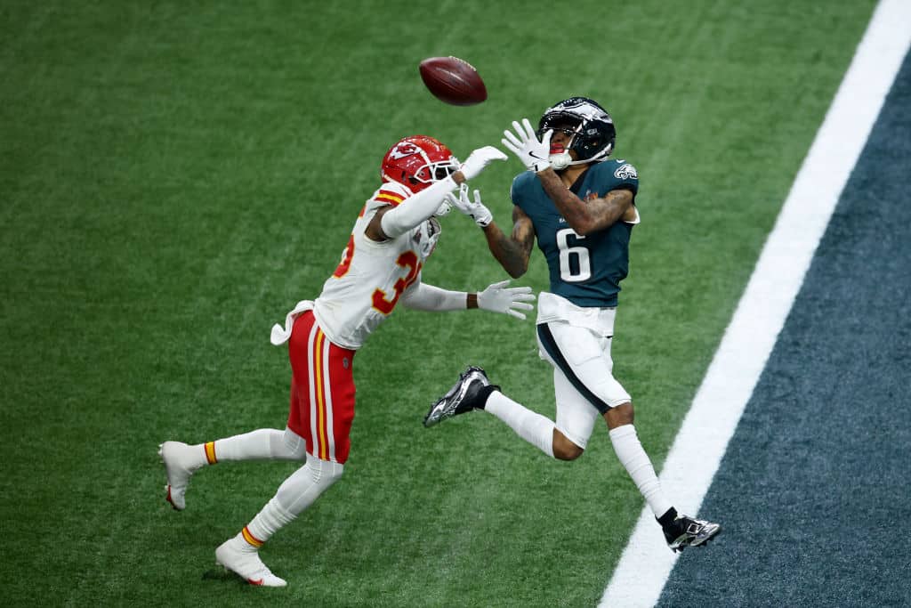 NEW ORLEANS, LOUISIANA - FEBRUARY 09: DeVonta Smith #6 of the Philadelphia Eagles catches a pass for a touchdown against Jaylen Watson #35 of the Kansas City Chiefs in the third quarter during Super Bowl LIX at Caesars Superdome on February 09, 2025 in New Orleans, Louisiana.