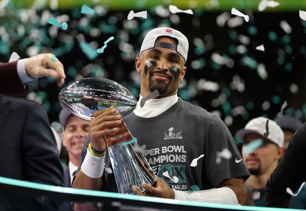 NEW ORLEANS, LOUISIANA - FEBRUARY 09: Jalen Hurts #1 of the Philadelphia Eagles celebrates with the Vince Lombardi Trophy after defeating the Kansas City Chiefs 40-22 to win Super Bowl LIX at Caesars Superdome on February 09, 2025 in New Orleans, Louisiana.