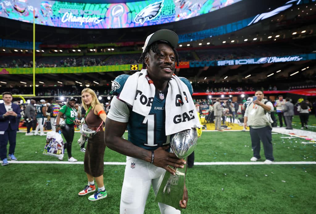 NEW ORLEANS, LOUISIANA - FEBRUARY 09: A.J. Brown #11 of the Philadelphia Eagles celebrates with the Vince Lombardi Trophy after beating the Kansas City Chiefs 40-22 to win Super Bowl LIX at Caesars Superdome on February 09, 2025 in New Orleans, Louisiana.