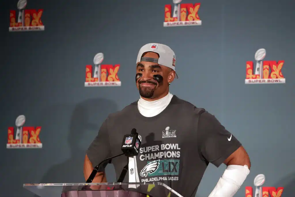 Jalen Hurts #1 of the Philadelphia Eagles speaks to the media during a press conference after beating the Kansas City Chiefs 40-22 to win Super Bowl LIX. Hurts launched 1 Mission clothing line for charity.