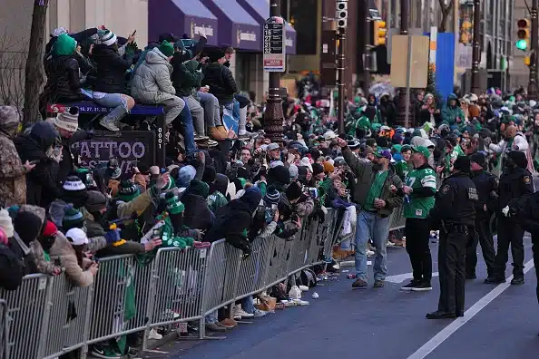 Former Philadelphia Eagles player Jason Kelce celebrates with fans during the Philadelphia Eagles Super Bowl Championship Parade