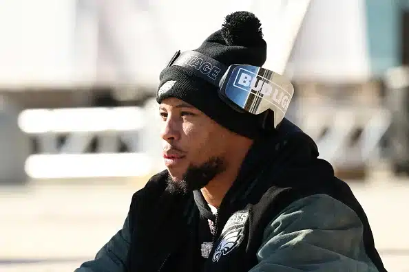 Saquon Barkley of the Philadelphia Eagles reflets on the parade from the steps of the Art Museum.