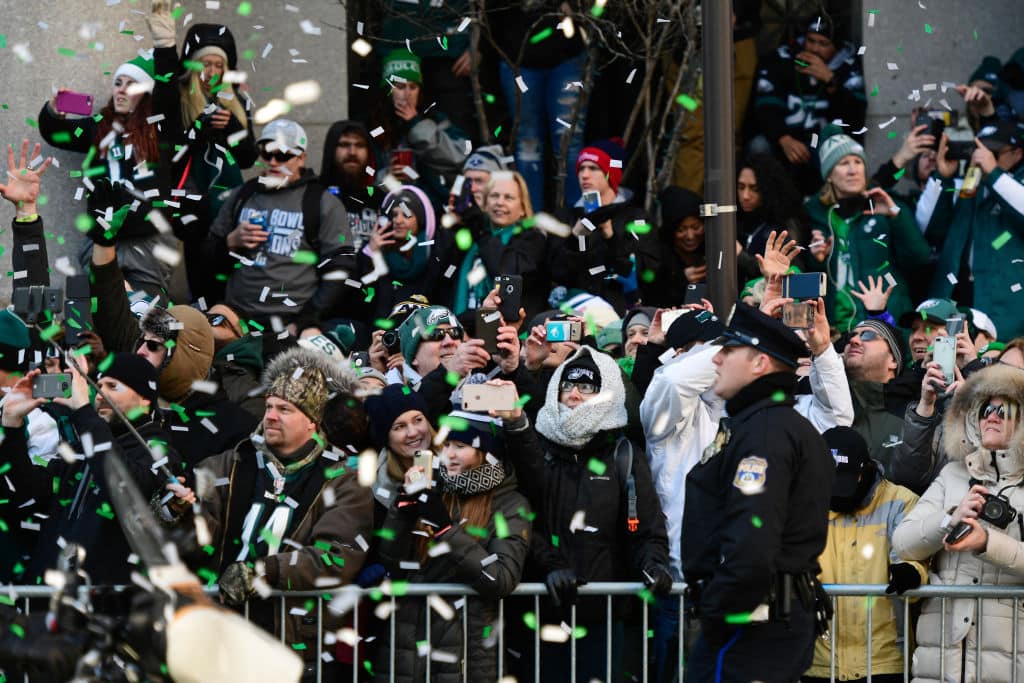 Eagles fans watch busses carrying the Philadelphia Eagles team pass by during the championship victory parade in 2018. Details announced for the Philadelphia Eagles Super Bowl LIX Victory Parade.