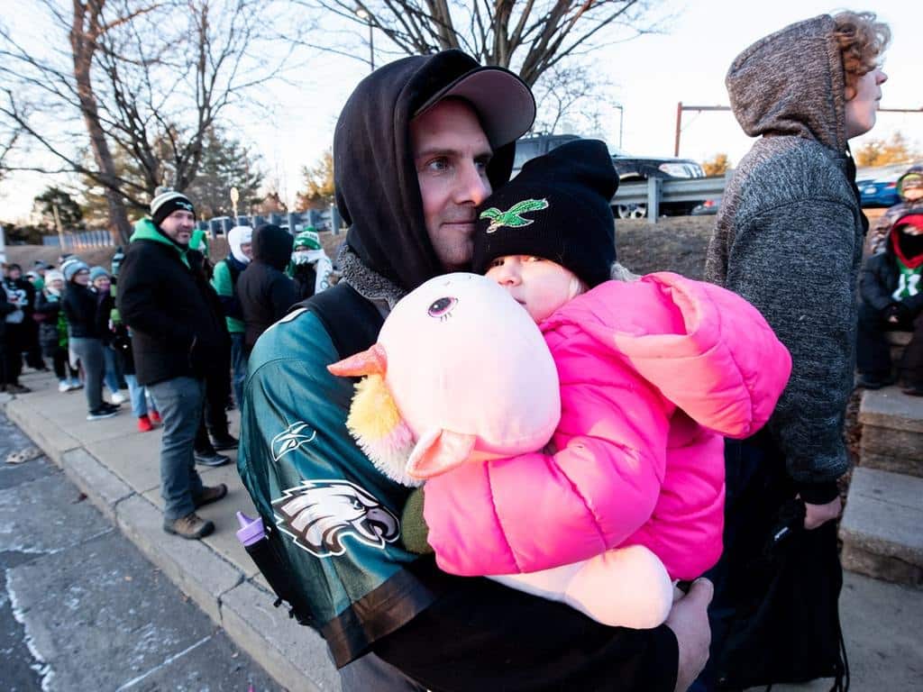 Ronnie Walsh, of Doylestown Borough, and his daughter, Laurel, 2, line up at the SEPTA Doylestown station, Friday, February 14, 2025, as they wait to board an early morning train headed to center city Philadelphia for the Super Bowl LIX parade.