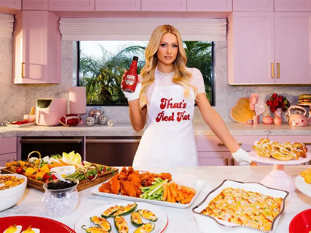 Paris Hilton with Frank's Red Hot