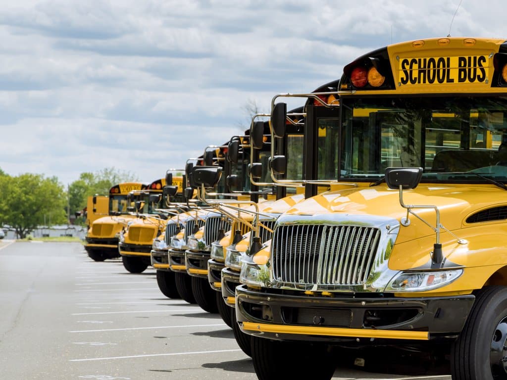 school busses parked in a row